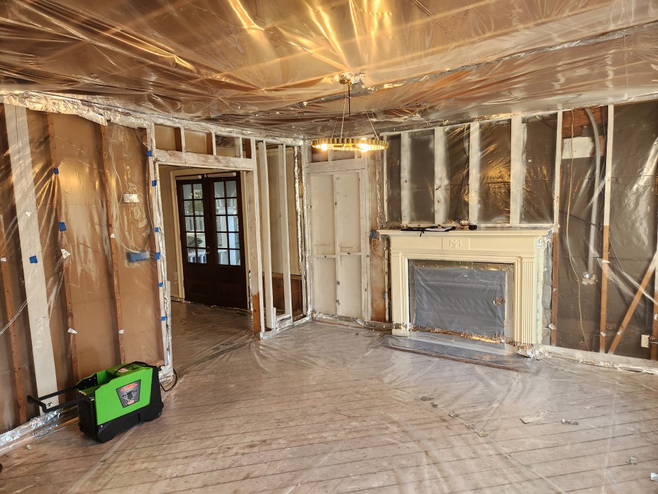 Alternate view of fireplace and wall before basement remodeling in Winder, GA.