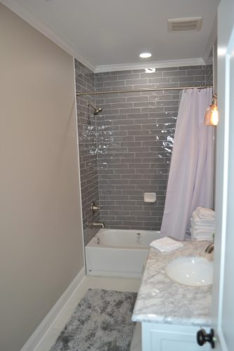 Basement remodel in Winder, GA with bathroom and tiled shower.